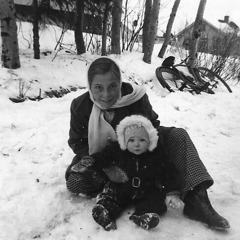 Children playing in the snow in the 1950s.