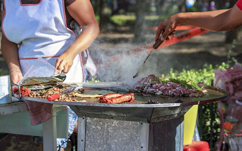 Someone making Mexican street food