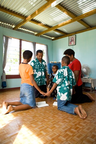 Family in Fiji praying