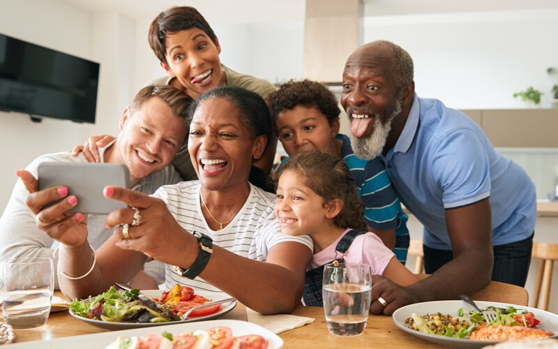 an african american mixed family takes a picture together