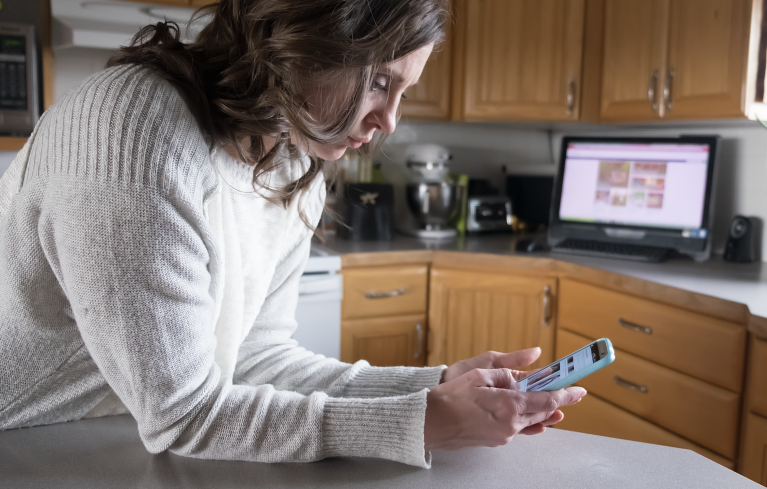 Woman Looking at Phone Cropped