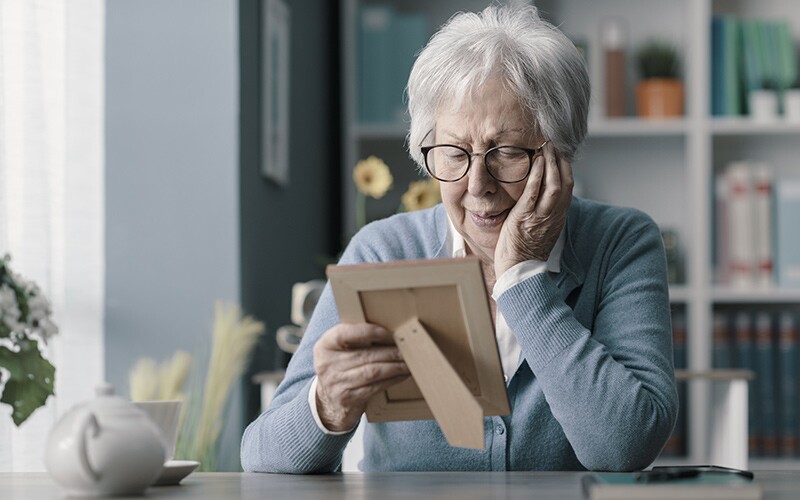 Old lady mourning loss of husband.