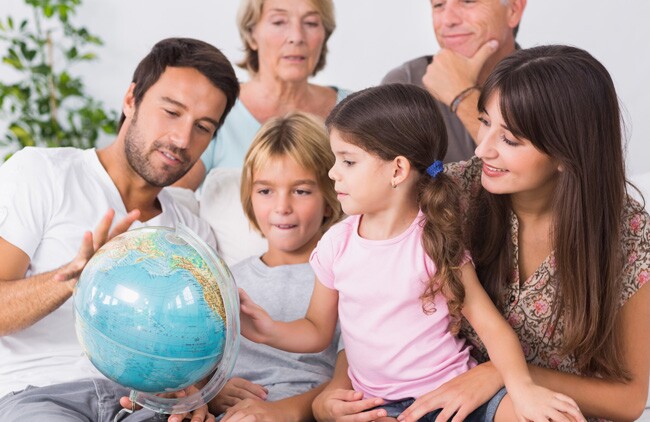 Family looking at different language locations around the world.