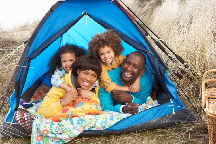 A family goes camping for Father's Day.