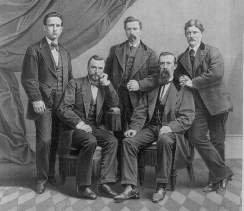 Men's clothing in the 1870s included three-piece suits.