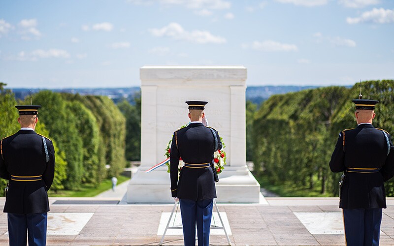 A changing of the guard occurs every hour to every half hour at the Tomb of the Unknown Soldier.