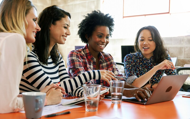 Woman showing indexing project to her friends.