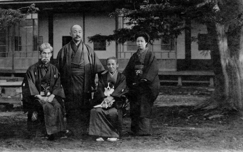 a historic photo of a japanese family.