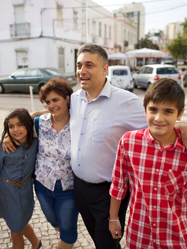 A father and mother with two children