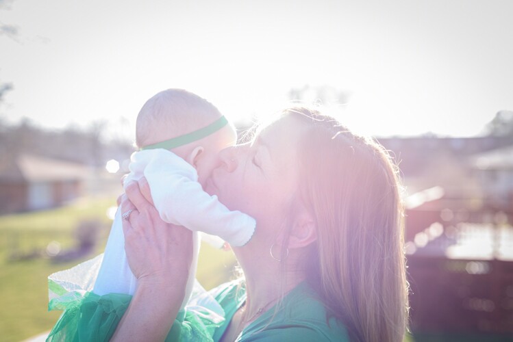 an irish baby with her mother, an event that would be recorded in irish records.