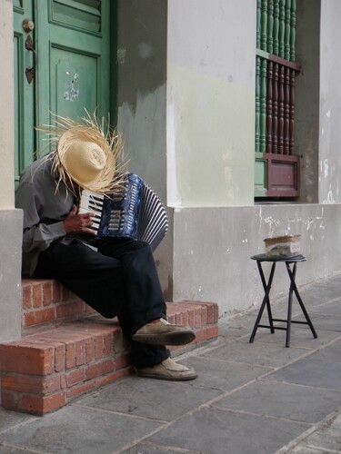 a man in puerto rico playing the accordion