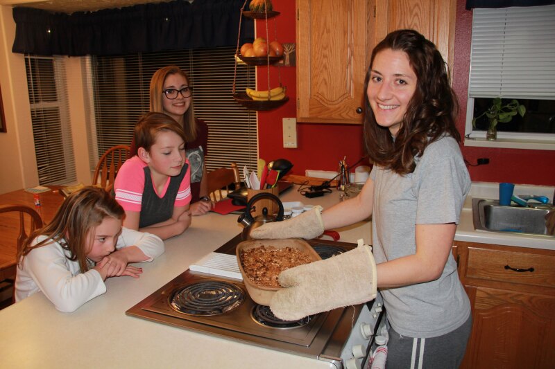 Baking apple crisp with family