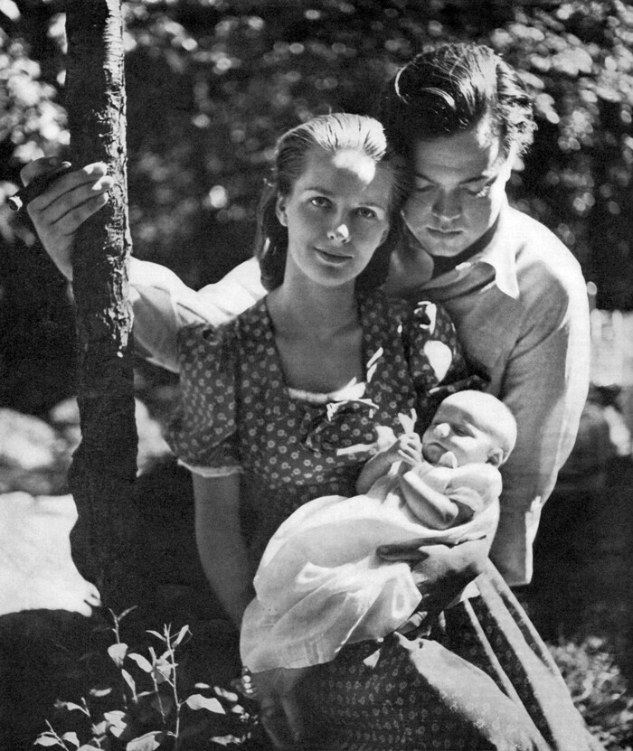 silent generation husband and wife holding baby