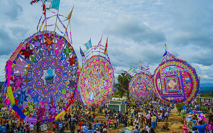 In Guatemala. people fly gigantic kites at the Barriletes Gigantes Festival in memory of their ancestors.