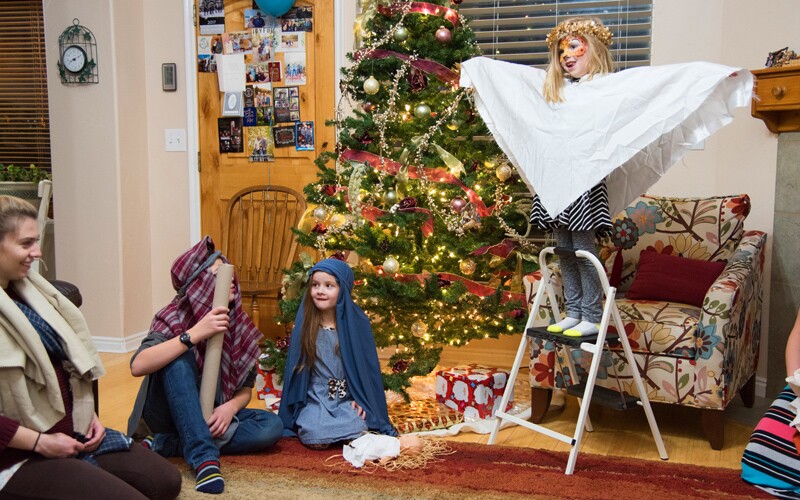 a family reenacts a holiday story.