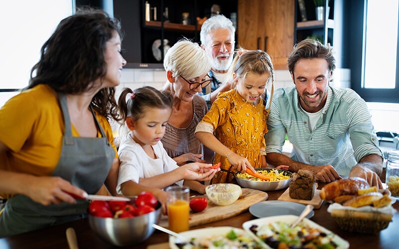 Family tree gathering making food together.