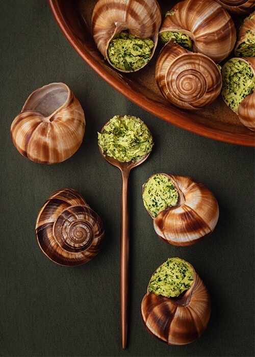 A dish of escargot on a table.