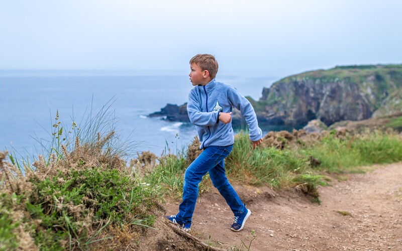 a boy runs in Wales.