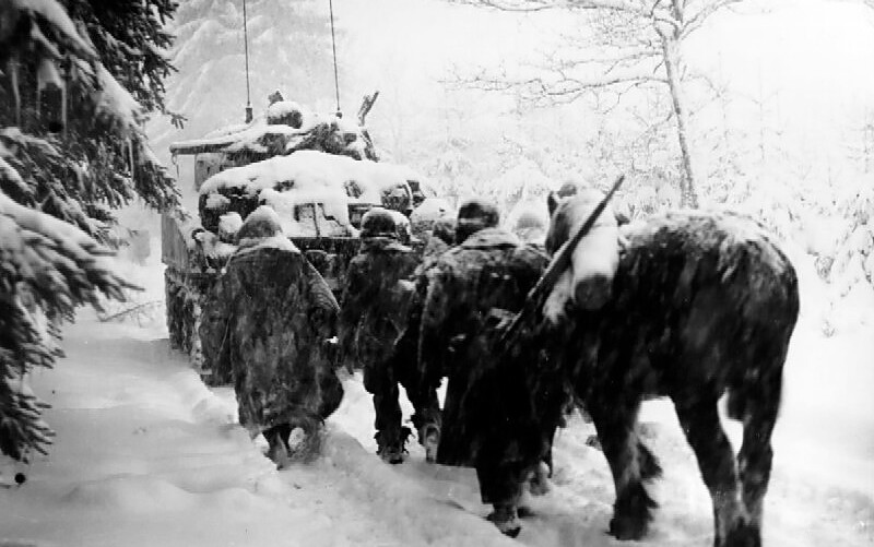 Soldiers walk in snow during Battle of the Bulge, a major world war 2 battle and turning point