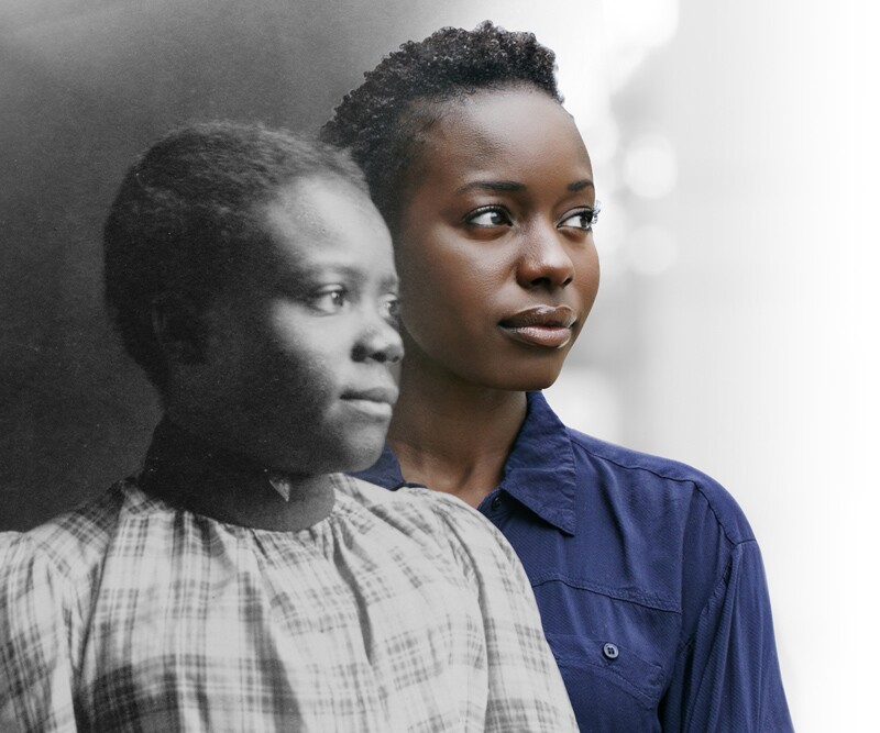 Young African American woman looking into the distance, in profile next to her ancestor.