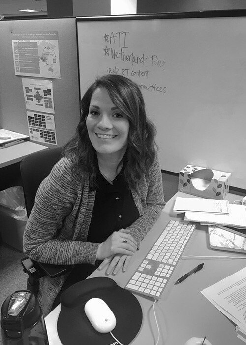 Courtney Connolly working at her desk as product manager for the FamilySearch Family Tree.