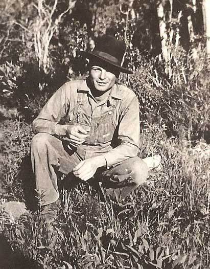 Man in overalls in the grass