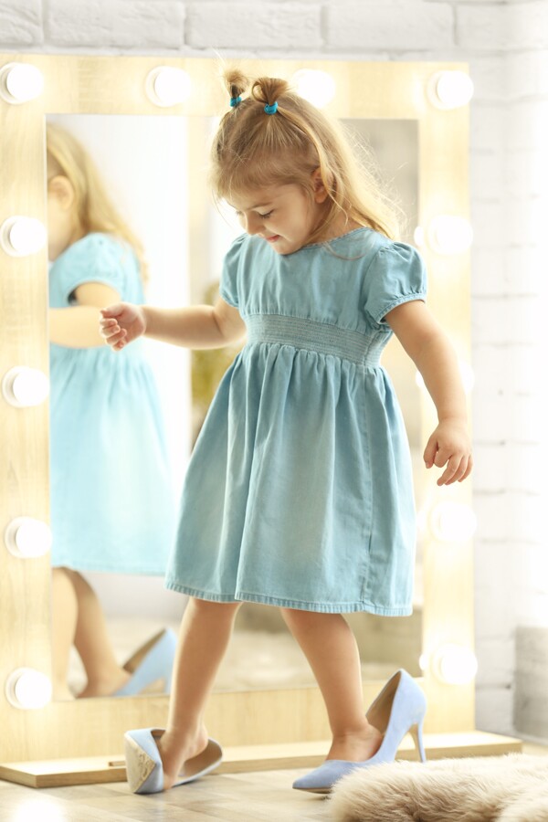 young girl in blue dress