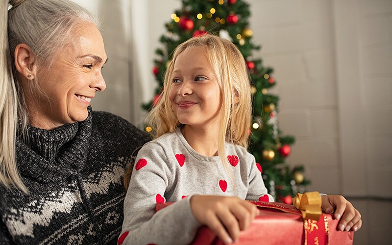 Grandma gifts granddaughter a family heirloom.