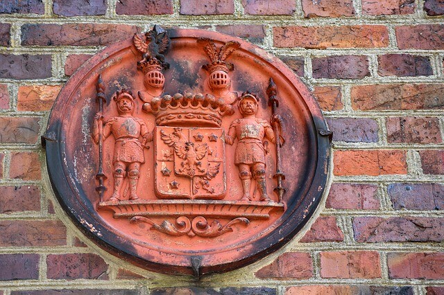 a coat of arms with a crest.