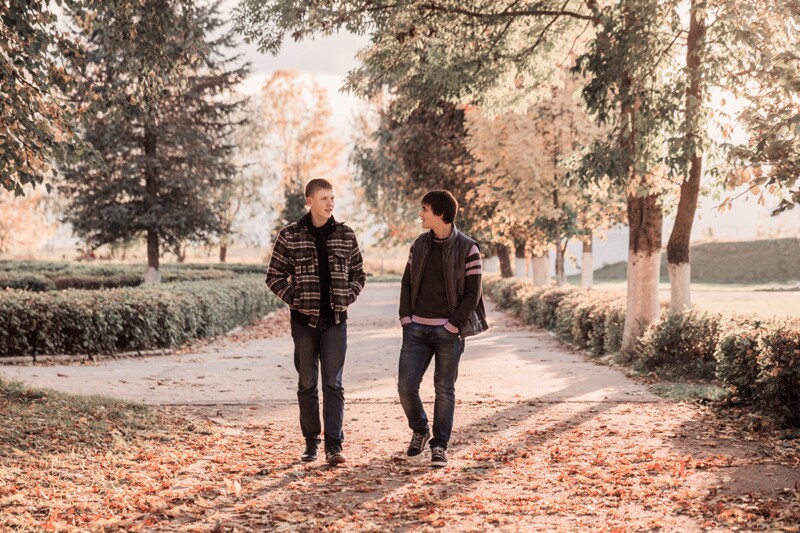 teenage boys walking outside