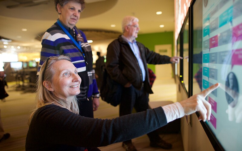 A woman enjoys a fun activity in the Family History Library.