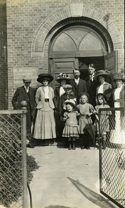 a family outside of a church building.