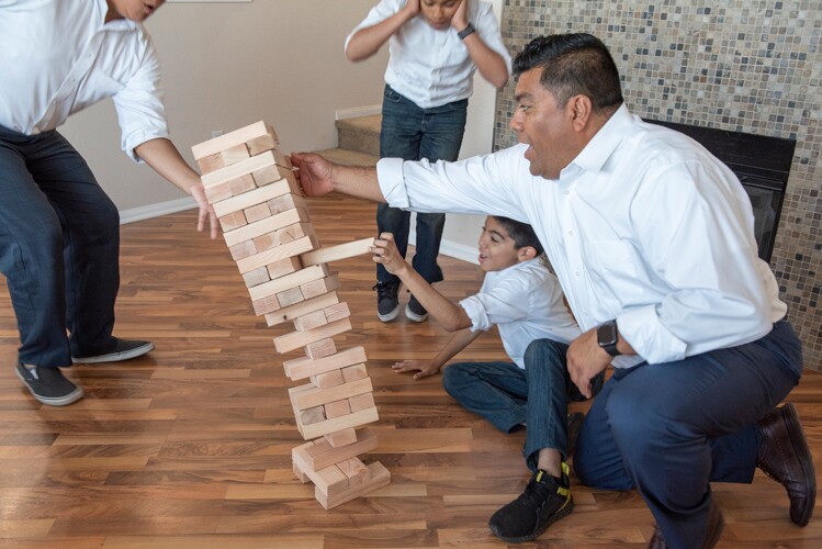 A family plays a game together.