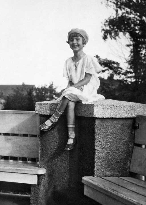 Young girl in 1930s fashion, sitting