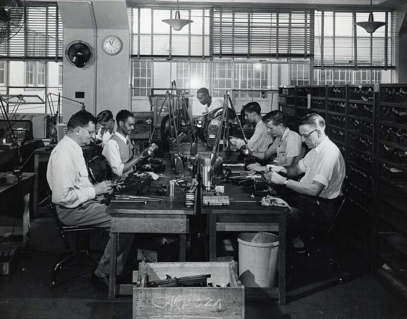 Group of enumerators using 1950 census machines.