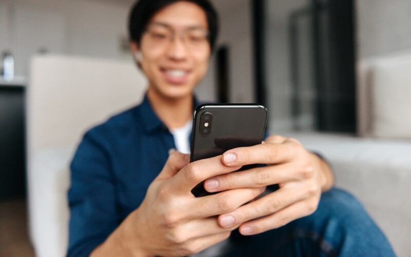 Man on phone on couch