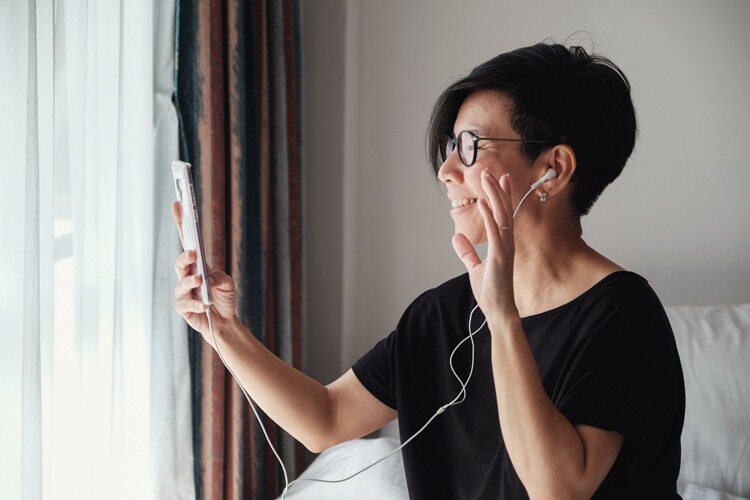 woman facetimes her family