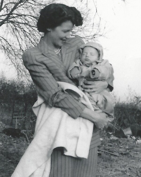 Mom holding baby in 1950