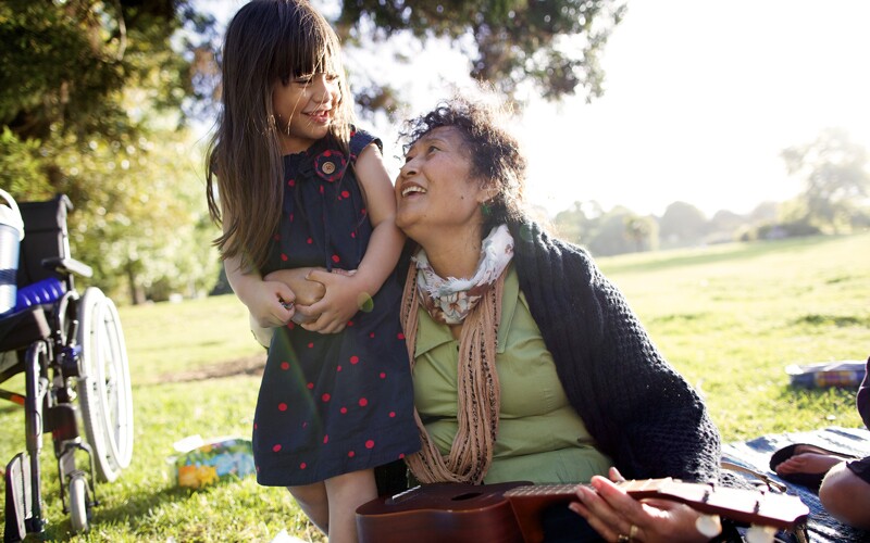 Grandmother with granddaughter outside. Reframing your stories to include the stories of your family builds resilience